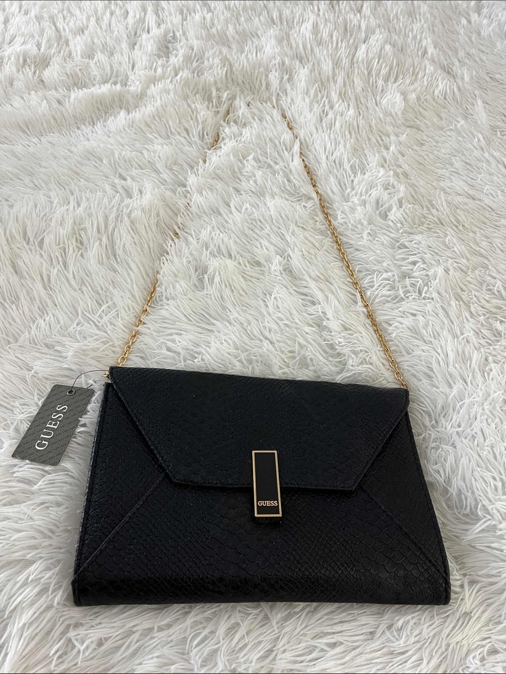 Guess clutch bag, with removable chain strap.